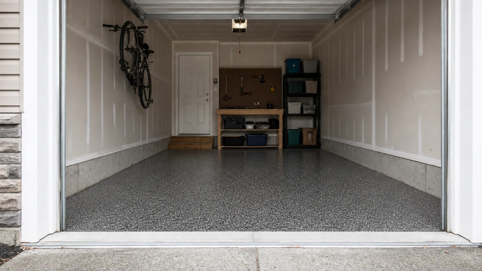 Close view of a charcoal decorative flake garage floor